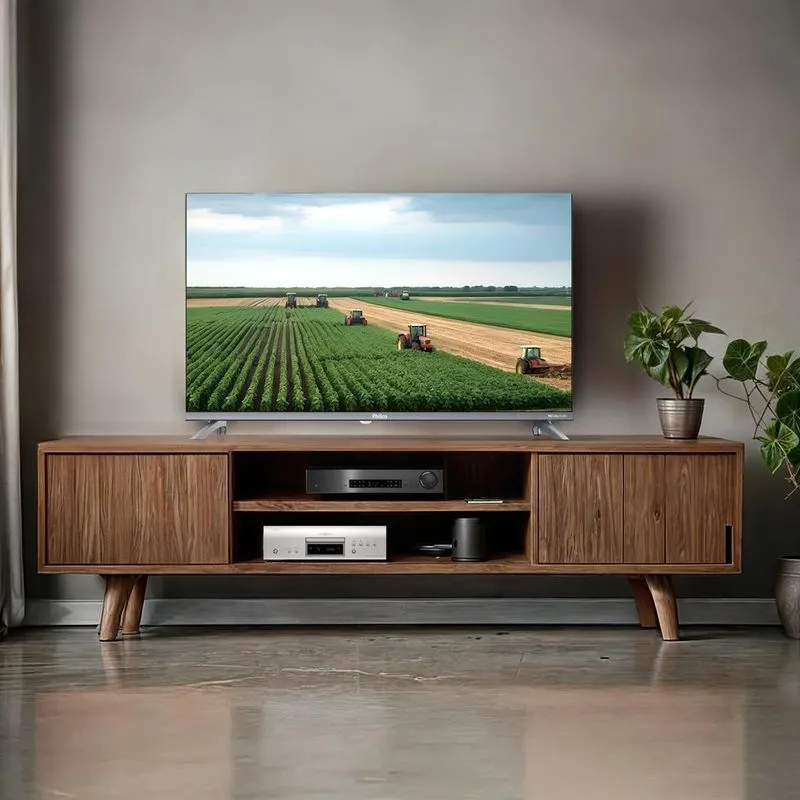 Smart TV Philco 32 polegadas PTV32M9GACGB com Android TV instalada sobre rack de madeira em ambiente compacto moderno